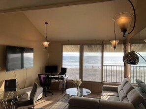 Partial view of living room.  Many new furnishings.  
