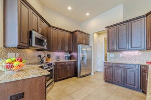 Modern Kitchen - - Cook with ease in a sleek, fully equipped kitchen with modern appliances
- Enjoy plenty of counter space and stylish cabinets designed for convenience
- Perfect for preparing meals and making memories in a warm, inviting atmosphere