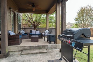 Patio with grill and outdoor furniture to enjoy grilling and hanging out.