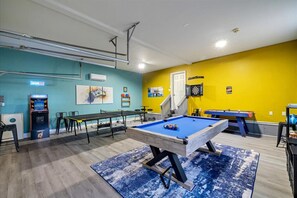 Ultimate game room packed with fun—enjoy darts, pool, ping pong, air hockey, arcade games, and more for endless entertainment!