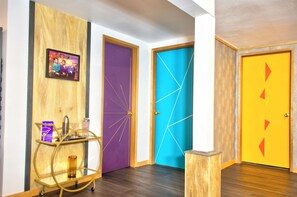 Color blocked mid-century doors, and  mirrored bar ready to serve a cocktail.