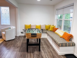 Foosball table and seating in the game area