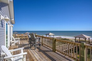 Oceanfront top deck seating, lounging and eating area