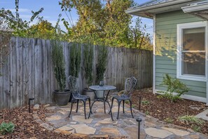 Cozy outdoor breakfast nook, perfect for morning coffee and peaceful starts.