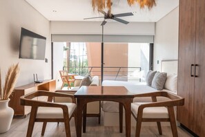 Dine at a cozy table near the kitchen, with stylish decor.