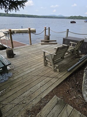 Deck on the shore of Green Lake that is attached to the dock.