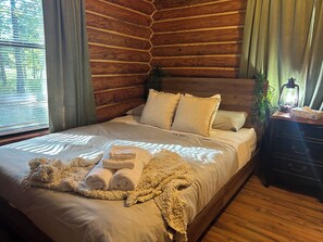Guest bedroom is equally cozy with charging station attached to bed frame!