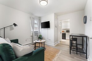 Relax in this stylish living area with modern furnishings and plenty of light