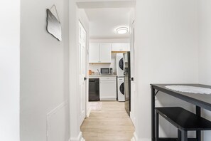 Enjoy this modern kitchen with appliances, ample counter space, and style.