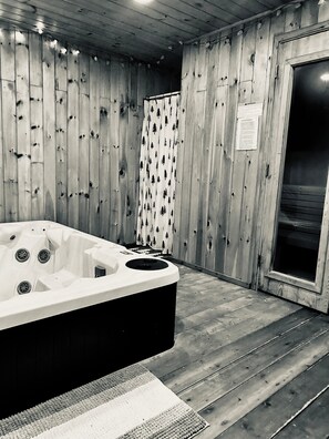 Indoor hot tub and sauna.  Also included in this space is a stand-up shower.  