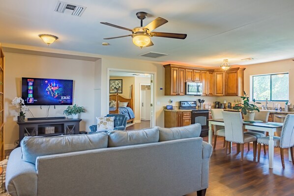 Spacious living room and full kitchen w/ dining area.
