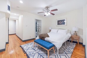 An airy and calm atmosphere bedroom with decorative rug