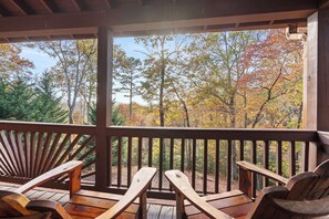 Unwind on the deck with serene forest views—your perfect escape awaits!