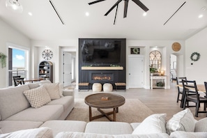 Cozy fireplace with a huge 100 inch TV