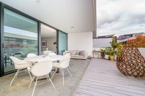 Serene, light-filled courtyard perfect for outdoor dining or relaxation.