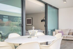 Serene, light-filled courtyard perfect for outdoor dining or relaxation.