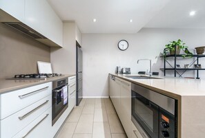 Fully equipped modern kitchen with sleek, stylish finishes.