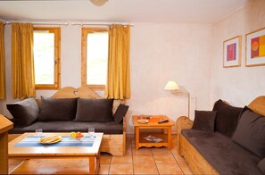 Snuggle up with a cup of coffee or tea on the comfortable sofa.