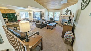 Upstairs: Living Dining, Kitchen, Primary Bedroom and Deck