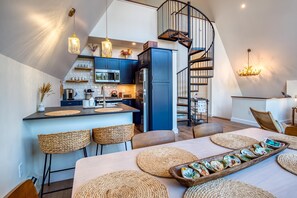 Kitchen and stairs to the loft.
