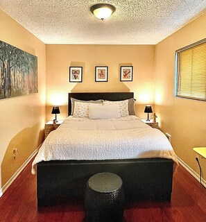 The Mushroom Room with matching bedside tables, workspace and ambient glow. 