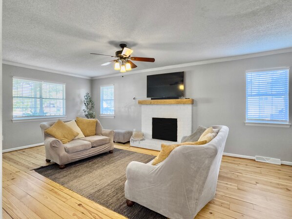Enjoy your open space living room with cozy lights that set the perfect mood.