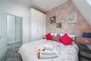 This bedroom guarantees comfort and relaxation after a long day. Meticulously designed with an ensemble complete with plush pillows and a duvet cover.