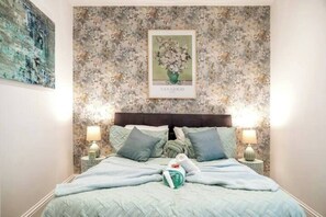 This bedroom guarantees comfort and relaxation after a long day. Meticulously designed with an ensemble complete with plush pillows and a duvet cover.