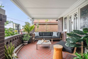 Sipping tea and savouring the view from this delightful verandah.