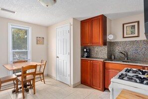 The kitchen overlooks the quiet Corcoran neighborhood. 