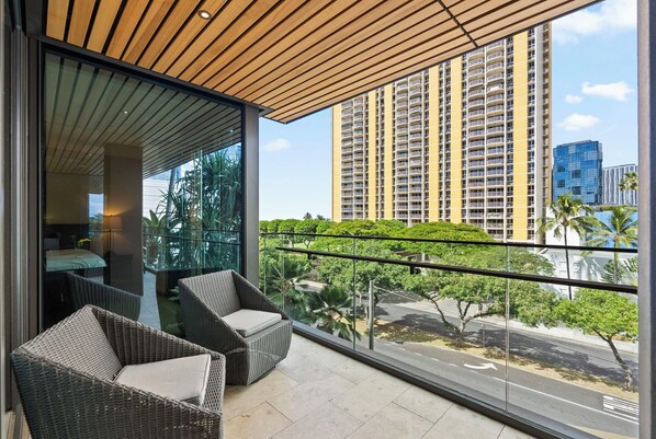 Stylish balcony with intimate seating, ideal for quiet moments.