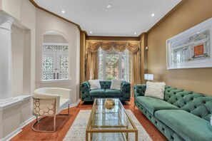 Living room with large window, plenty of seating, perfect for your private time!