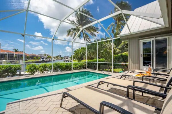 Enjoy a refreshing swim in the full-screened pool 