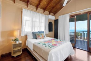Wake up to the gentle sea breeze in the second bedroom set with a queen bed.
