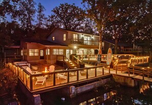 As night falls, the entire property lights up with a magical glow, creating a cozy, inviting atmosphere that’s perfect for evenings spent outdoors or quiet moments by the lake.