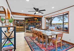 Settle into this spacious dining room where every meal feels special, thanks to the stunning lake views and cozy atmosphere.