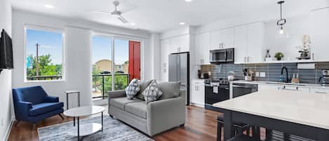 Unwind in the bright living area, with a queen sofa sleeper & Smart TV