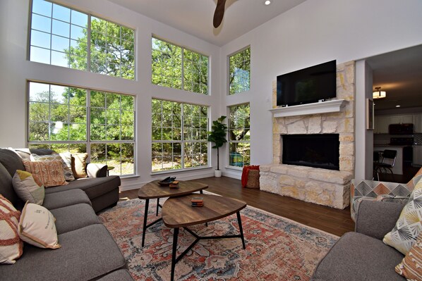 Curl up in the airy living room & enjoy a movie night in style