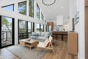 Vaulted ceilings with walkout access to private deck with outdoor dining and fire-pit
. 