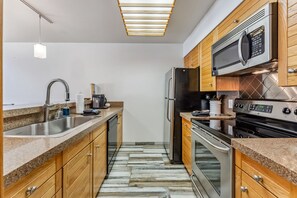 Kitchen: Keurig, Crockpot, blender, toaster, cooking utensils, tableware