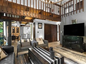 Unwind in our spacious living area with its cozy vibes. Perfect for relaxing after exploring.