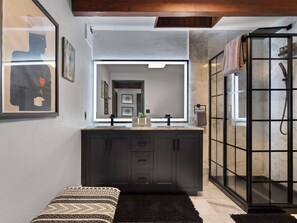 Indulge in our spa-like bathroom. Refresh in the stylish shower and enjoy the sleek double vanity. 