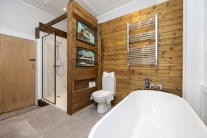 New Beautifully Designed Bathroom, with bespoke bathtub and sleek walk in shower.
