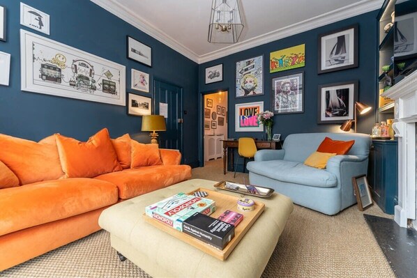 Bright and bold living room with beautiful, high ceilings - great for entertaining.