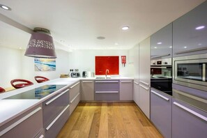Large kitchen with 2 ovens, 2 dishwashers, a big hob and plenty of space for a great dinner party!