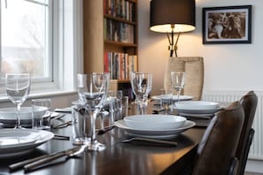 Have a home cooked meal with your friends and family on this dining table.