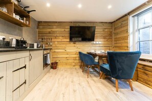 The kitchen area is fully stocked with all the necessary amenities