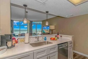Updated coastal-style kitchen with stunning views of the ocean!