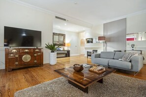 Relax in a spacious living room that blends classic character with contemporary comfort.
