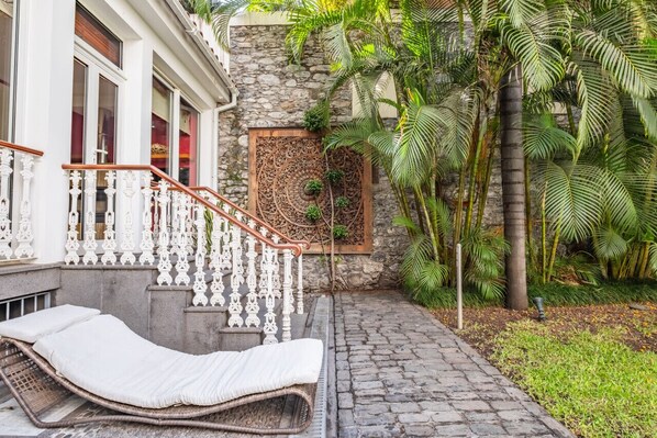 Lounge beneath the trees in a private retreat made for quiet afternoons.
